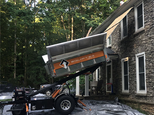 Equipter roofing trailer in use during new roof installation in Charlotte